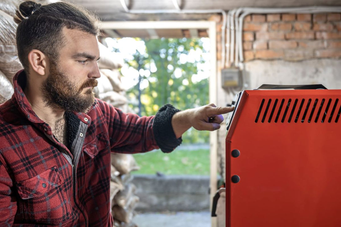 Man installing a diesel air heater in a garage